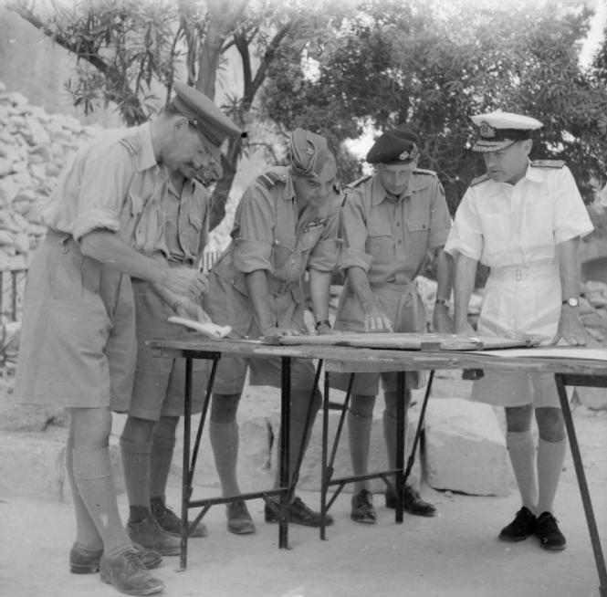 Field Marshal Bernard Montgomery along with Admiral Sir Andrew Browne Cunningham C-in-C Mediterranean outside the LWR with other RAF and military personnel in 1943